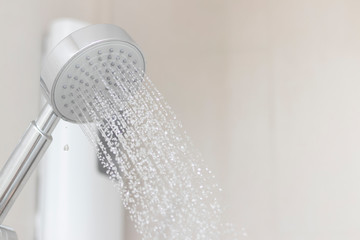 Stainless steel shower in the bathroom that opens to allow water to flow To prepare to take a shower.