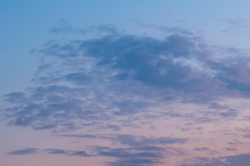 Sunset sky with soft gray clouds. Cloudscape for background..