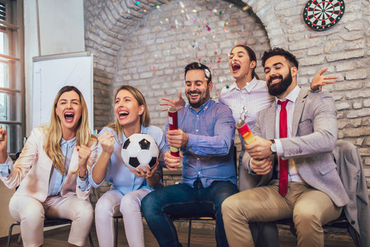 Happy Business People Or Football Fans Watching Soccer On Tv And Celebrating Victory. Friendship, Sports And Entertainment Concept.