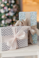 gift wrap  Christmas  with bow, pastel colors under the tree.  wrapping paper gift for girls