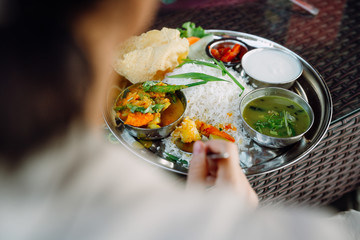 Set of vegetarian plates with Nepalese and Indian style food. Different types of curry