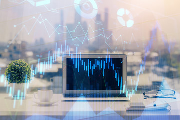 Forex Chart hologram on table with computer background. Multi exposure. Concept of financial markets.