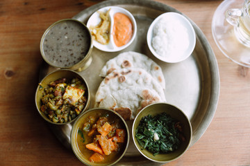 Top view of Nepali vegetarian set. Bowls with different curry