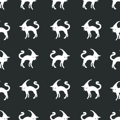 Seamless halloween vector pattern of white cats in the hats on the gray background