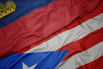 waving colorful flag of puerto rico and national flag of liechtenstein.