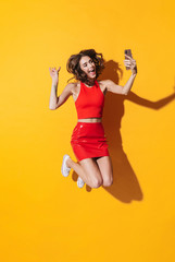 Full length portrait of a lovely cheerful young girl