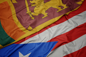 waving colorful flag of puerto rico and national flag of sri lanka.
