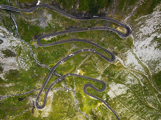 Aerial view of endless road turns at the mountain pass road Transfagarasan during summer connecting Transylvania and Wallachia (Romania, Europe)