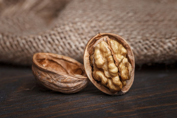 walnuts in a basket on a wooden table