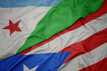 waving colorful flag of puerto rico and national flag of djibouti.