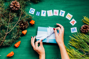 women's hands Christmas new year tree decoration gifts