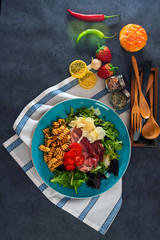 tasty pasta with roast ham on the table