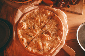 delicious fresh homemade pizza on the table. pizza with pear and green blue cheese