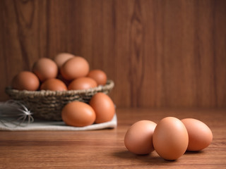 Close up image of organic chicken eggs are one of the food ingredients on wooden table and background with copy space to prepare for cooking. Organic chicken eggs food ingredients concept