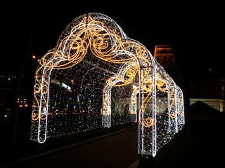 bright illuminated arch at Christmas night