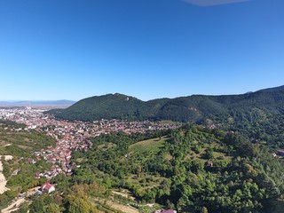 Obraz premium On the top of the city. Drone footage. Romanian mountains.