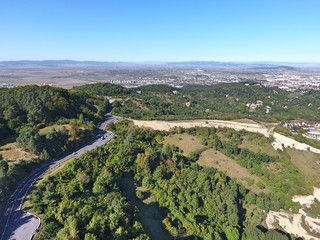 Fototapeta na wymiar On the top of the city. Drone footage. Romanian mountains.
