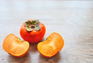 orange persimmon on a light background southern sweet fruit