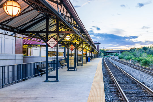 Burke, USA - April 16, 2017: Burke Centre train station platform with sign and tracks