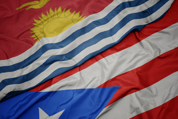 waving colorful flag of puerto rico and national flag of Kiribati .