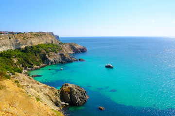 Fototapeta na wymiar Beautiful azure sea and rocky cliffs. Black sea, Crimea. 
