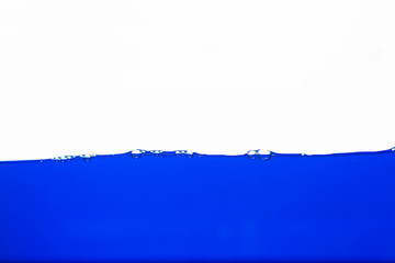 Close up blue Water splash with bubbles on white background