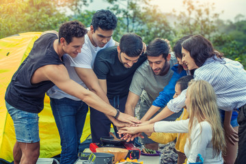Group of friends backpacks enjoy in forest and hand join together. Adventure, travel, tourism, hike and people friendship concept.