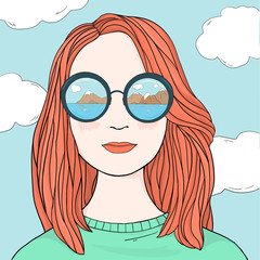 Fototapeta na wymiar Portrait of a beautiful woman with long red hair in mirrored glasses.
