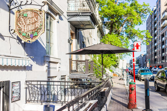 Montreal, Canada - May 27, 2017: Au Vieux Saint Hubert restaurant sign on street in neighborhood in city in Quebec region