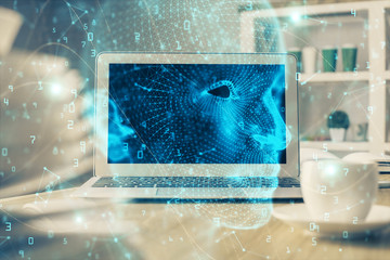 Double exposure of table with computer and brain hologram. Data innovation concept.