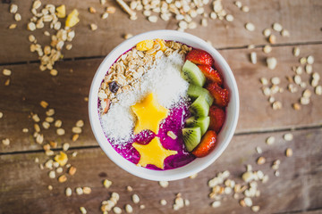 healthy natural food – smoothie bowl with fruits and granola