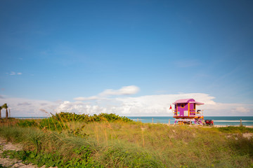 Fototapeta premium Photo Miami Beach lifeguard tower purple by the dunes