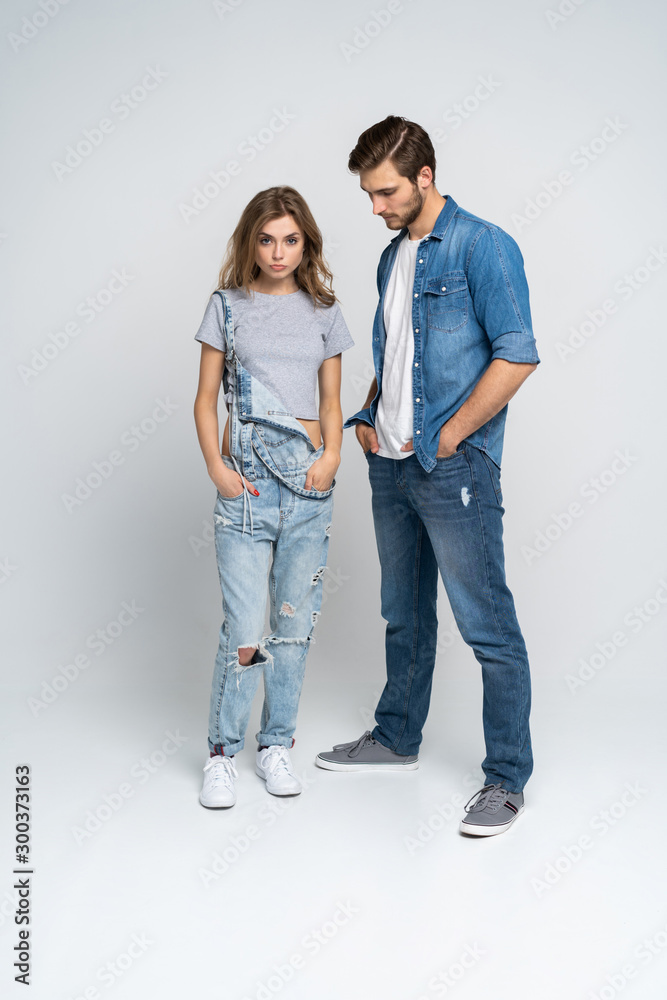 Wall mural Portrait of happy couple isolated on white background. Attractive man and woman being playful. - Wall murals
