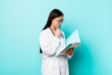 Young asian doctor woman holding a folder