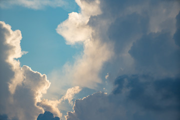 Fototapeta na wymiar Moody storm clouds on blue sky