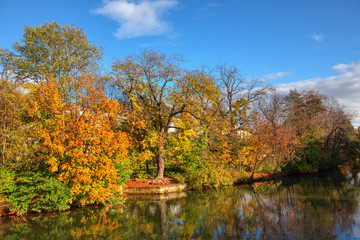 Amazing autumn scenery with calm lake and colorful trees