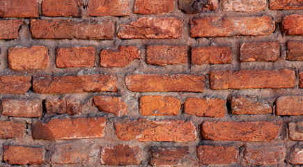 Old vintage light red and brown brick material texture retro wall background.