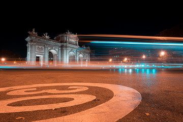 Night view of Puerta de Alcala with traffic lights in Madrid, Spain. Copy space available and 30 km...