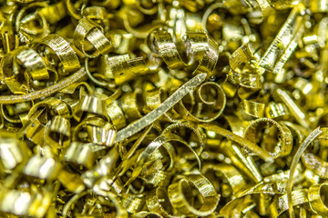 Metal shavings close-up multicolored, abstract background. Production waste.