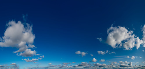 Fototapeta na wymiar Fantastic clouds against blue sky, panorama