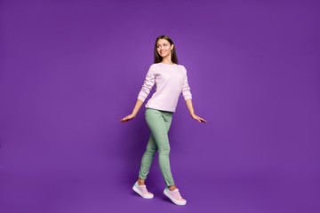 Fototapeta na wymiar Full length body size photo of charming gorgeous fascinating girl dancing in calm like ballerina smiling toothily looking away isolated over vivid purple color background