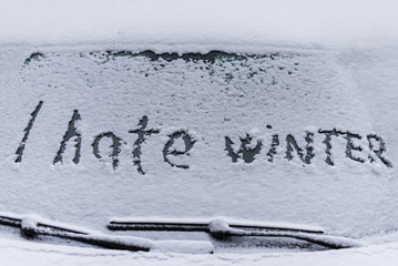 I hate winter phrase on the car window. Winter negative, concept