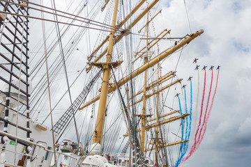 French Acrobatic Patrol flying over tall ship Kruzenshtern, Armada 2019, Rouen, Seine River, Normandy, France