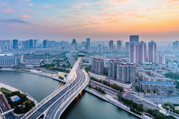 Fototapeta na wymiar Early morning city scenery of Chifeng Bridge, Tianjin, China