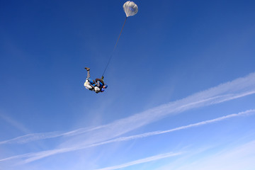 Naklejka na ściany i meble Skydiving. Tandem jump. People in the sky.