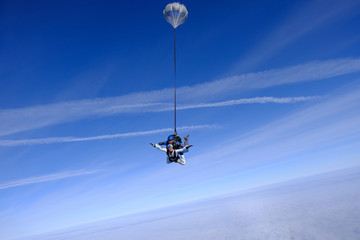 Skydiving. Tandem jump. People in the sky.