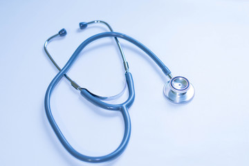Medicine and health concept. Stethoscope on blue background close up