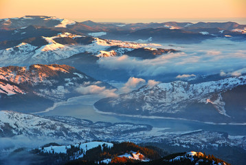 Fototapeta na wymiar Aerial winter panorama over misty valley