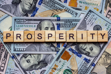 The word prosperity on dollar usa background. Welfare, sufficiency and wealth concept - 300381748