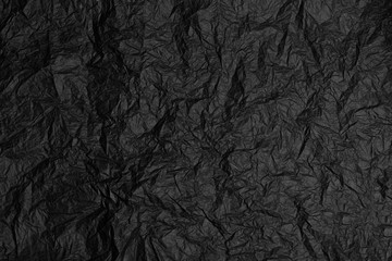 Crumpled black paper background. grunge texture. Copy space.